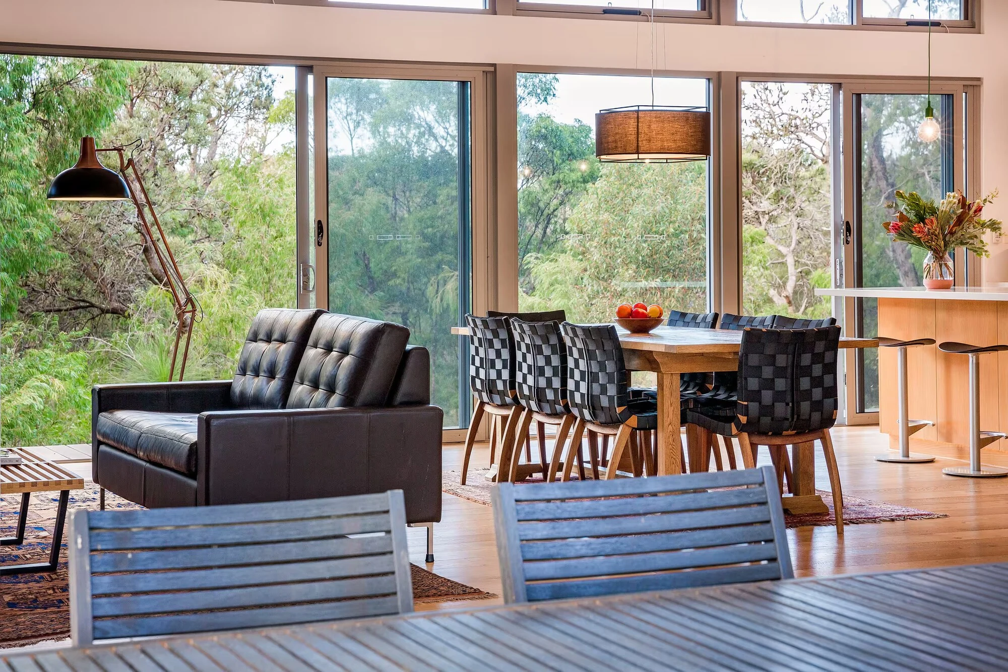 The dining and living areas at Injidup Sanctuary viewed from the outdoor dining table